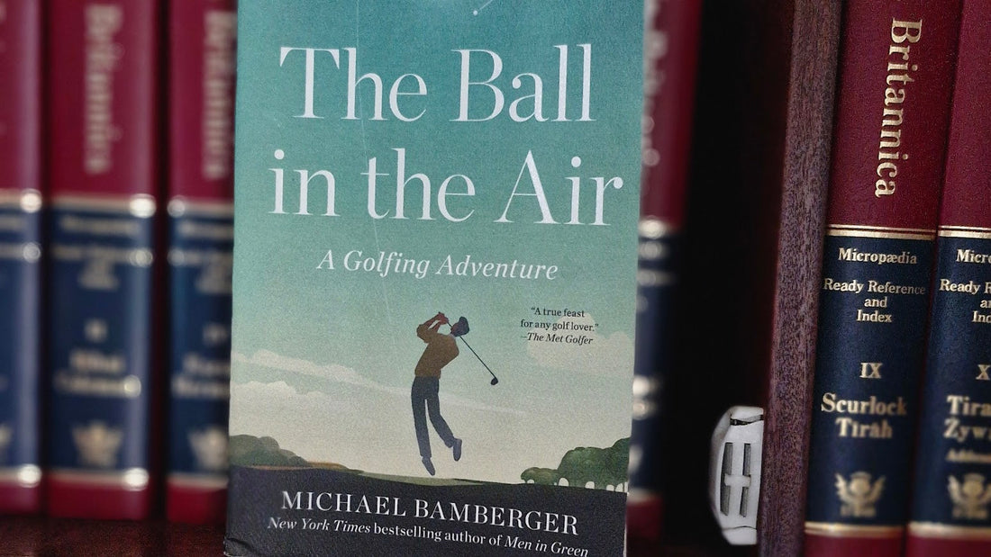 The Ball in the Air by Michael Bamberger book cover, in front of other books