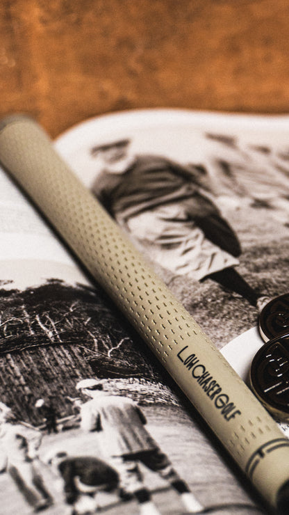 Cream Low Chaser Grip, on a background of the golf journal magazine.